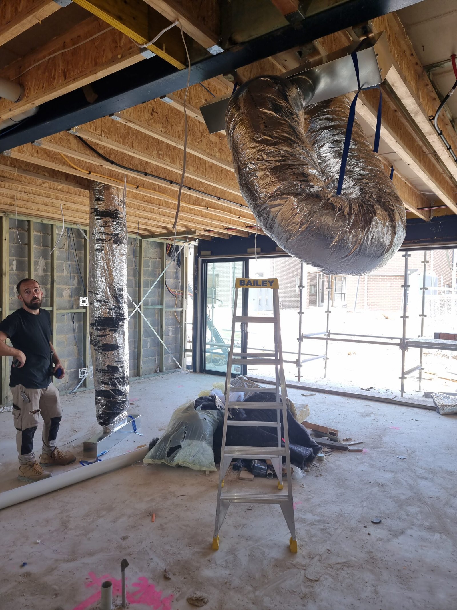 Mechanical ventilation flexible ductwork being inspected during a Sydney project